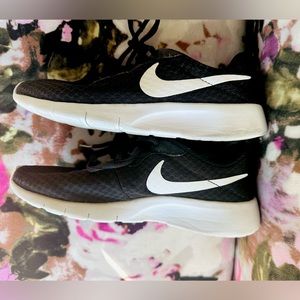 Nike running shoes for boys or girls. 4Y, see tag, in near perfect condition.